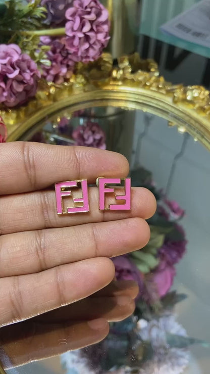 F pink earrings